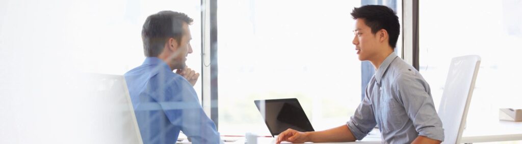 A sales rep discussing a deal with a prospect